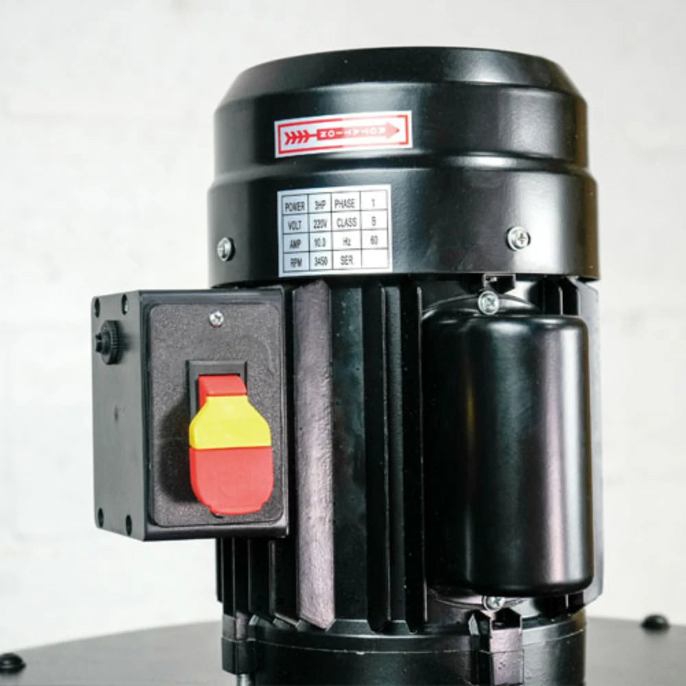 Toggle clamp latch secures dust drum lid for airtight collection