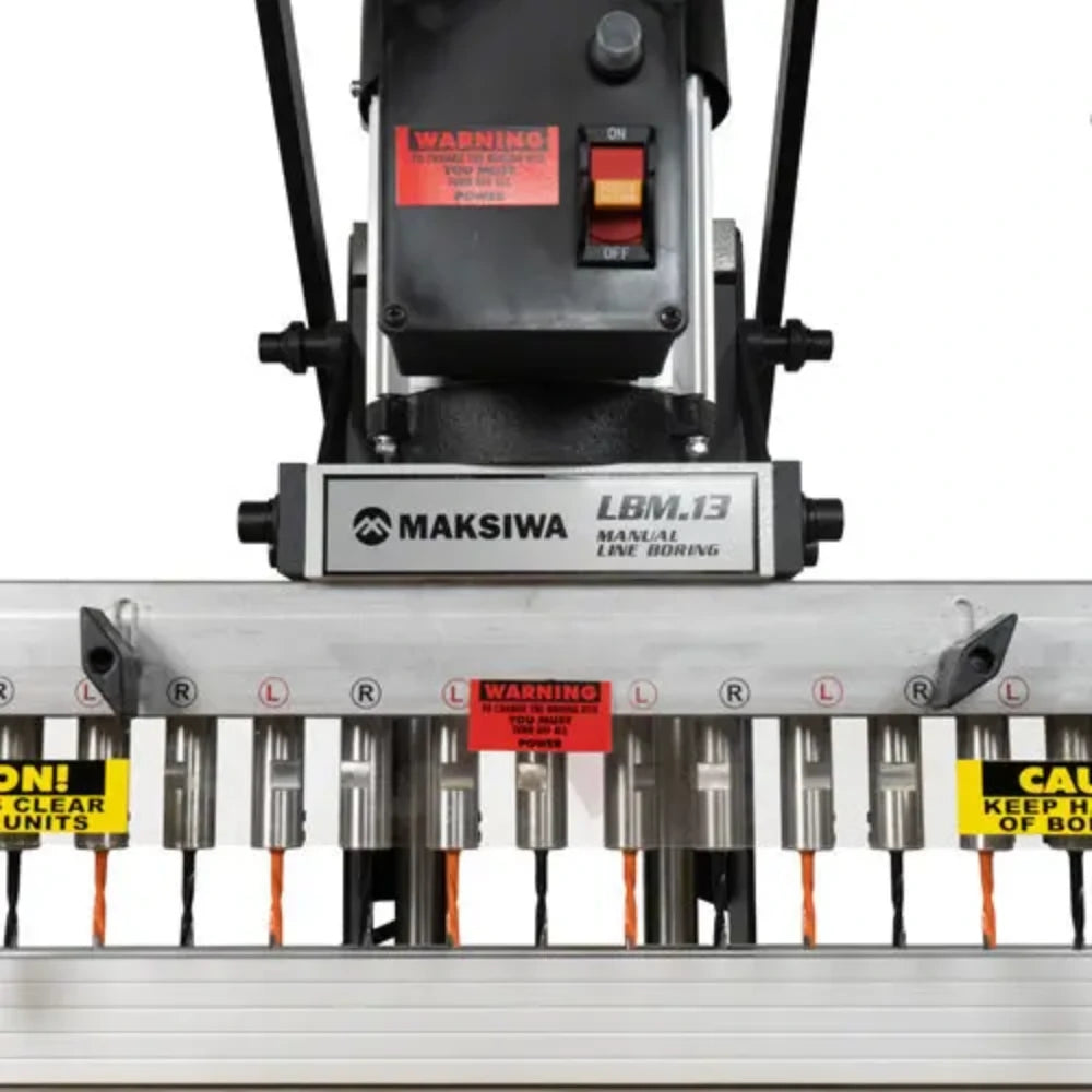 Close-up of 13-spindle drill head for cabinet shelf pin holes