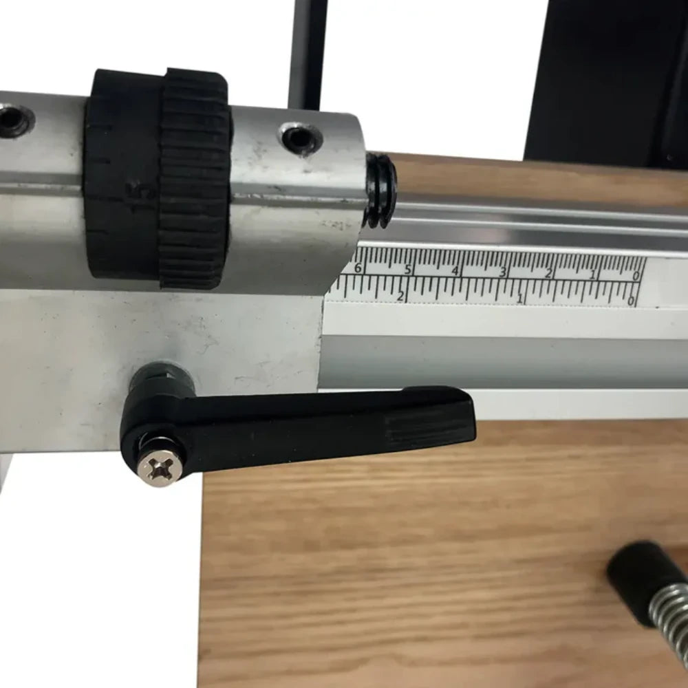 Spring-loaded hold-down foot stabilizing panel during drilling cycle