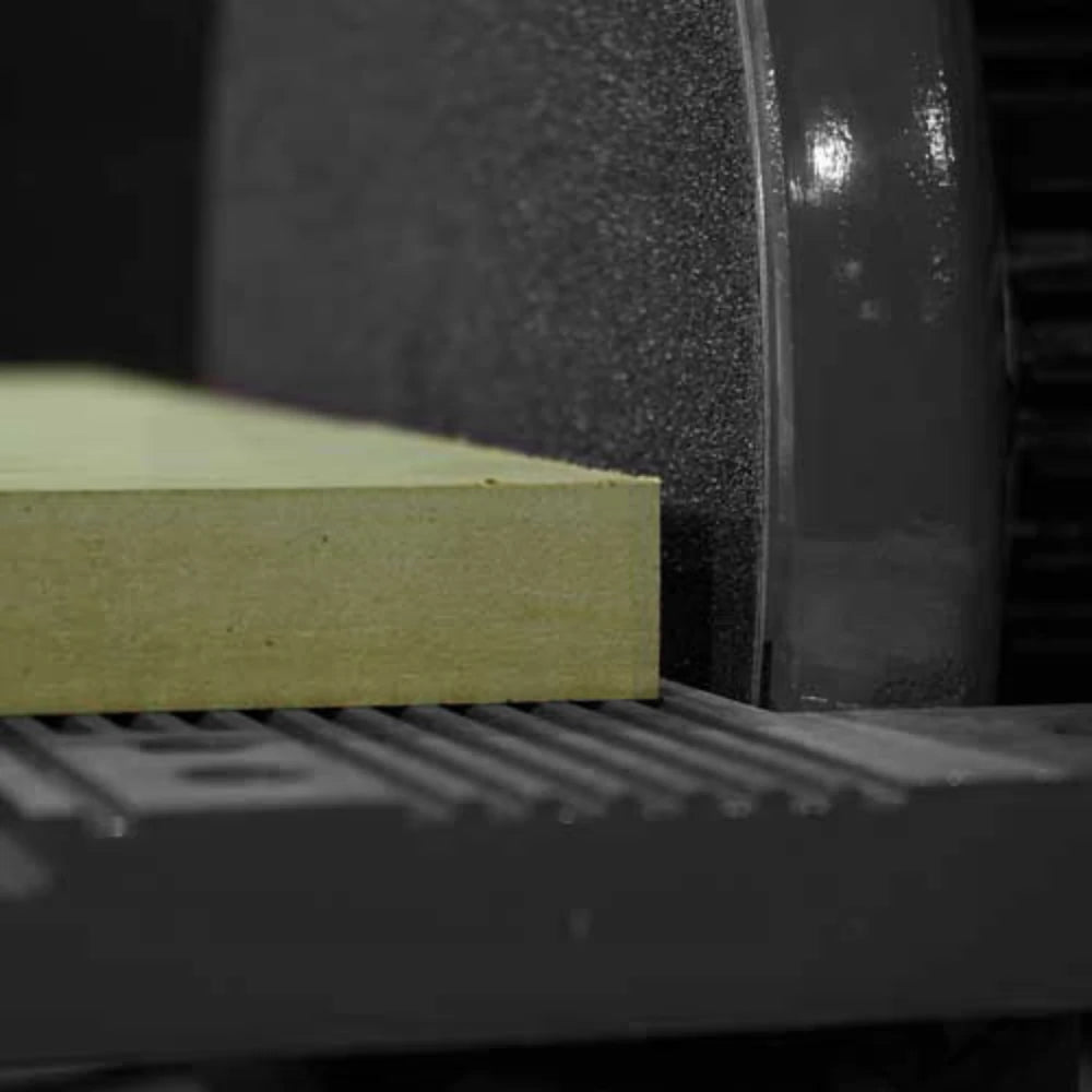 Disc sander squaring MDF edge against abrasive sanding wheel