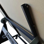 Close-up of angled support bracket holding large sheet goods securely