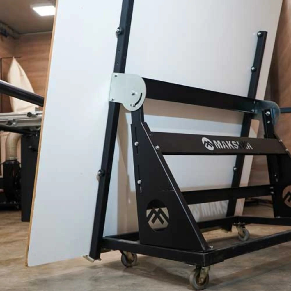 Woodworker moving full-size panel onto Maksiwa rolling carrier